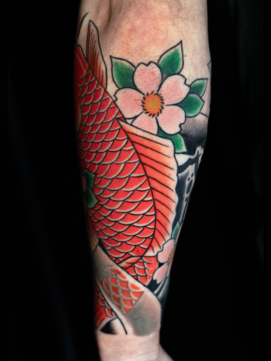 Jonathan koi lower sleeve back of arm Japanese tattoo Atlanta Georgia by Brian Bennett at Ink and Dagger