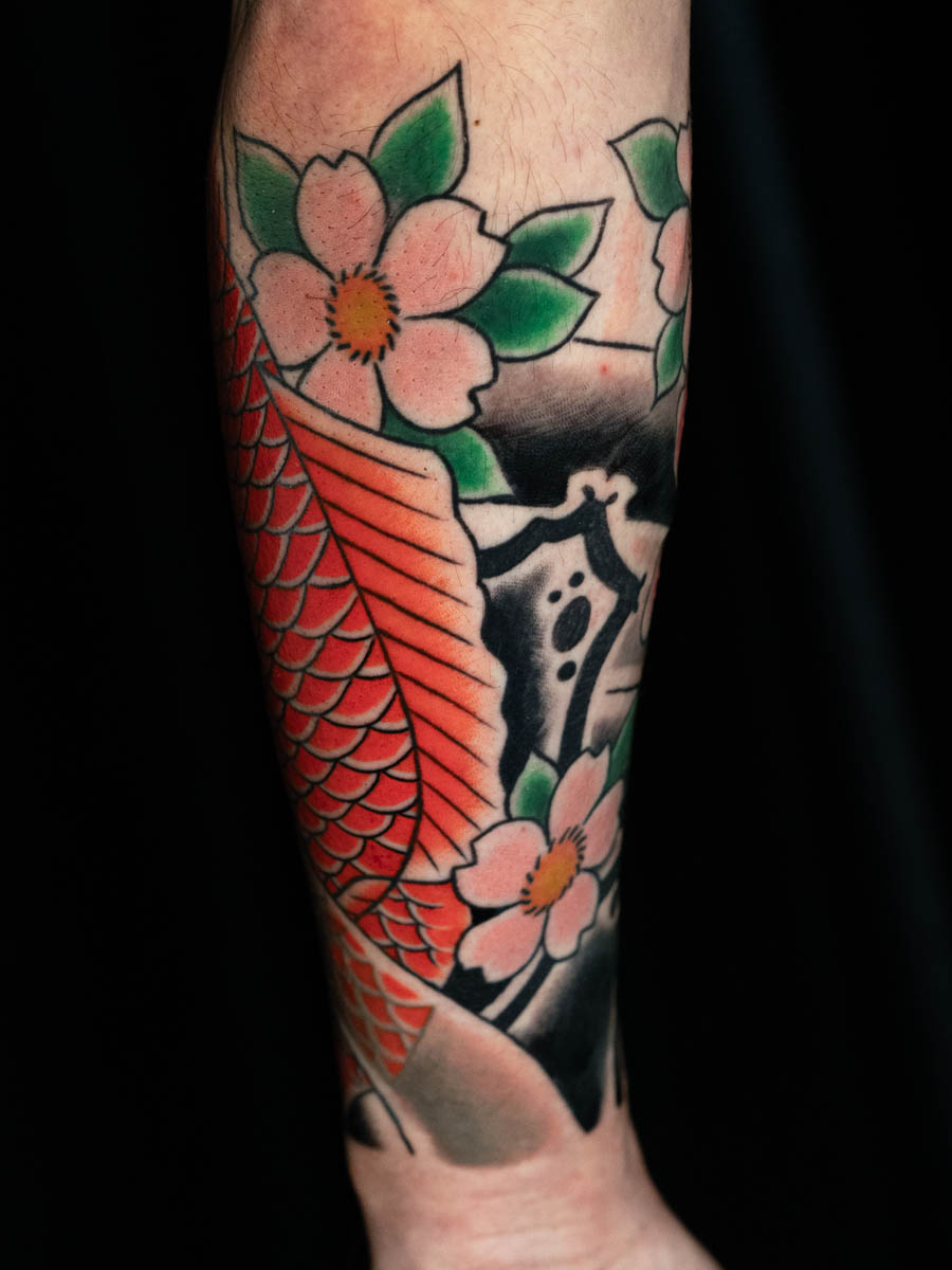 Jonathan koi tail sakura rock lower sleeve Japanese tattoo Atlanta Georgia by Brian Bennett at Ink and Dagger